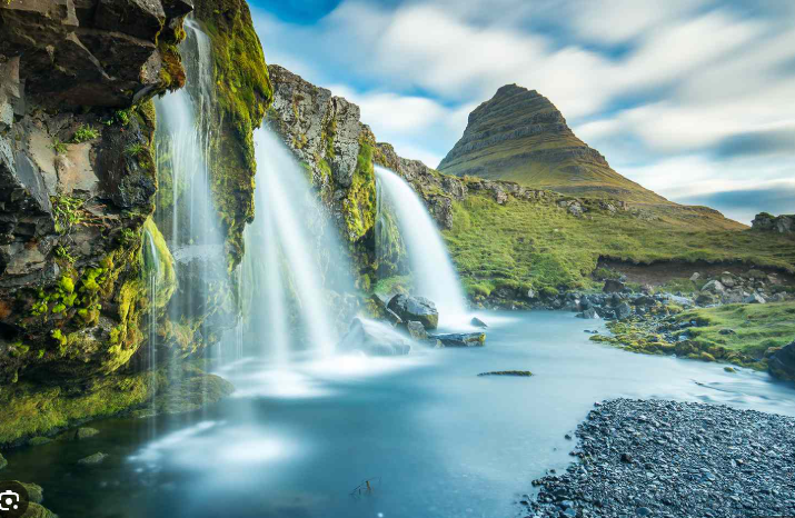 A dramatic waterfall seen from a drone